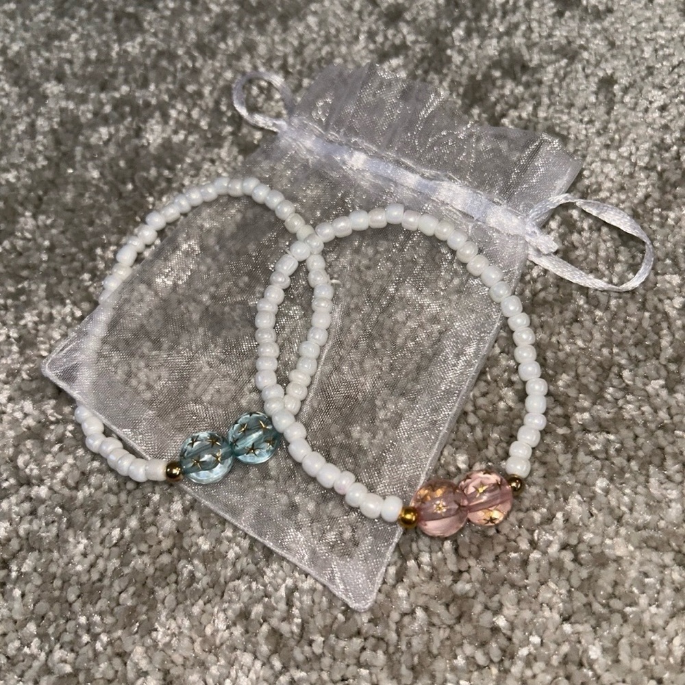 Set of 2 White Beaded Bracelets with Pink and Blue Accents
